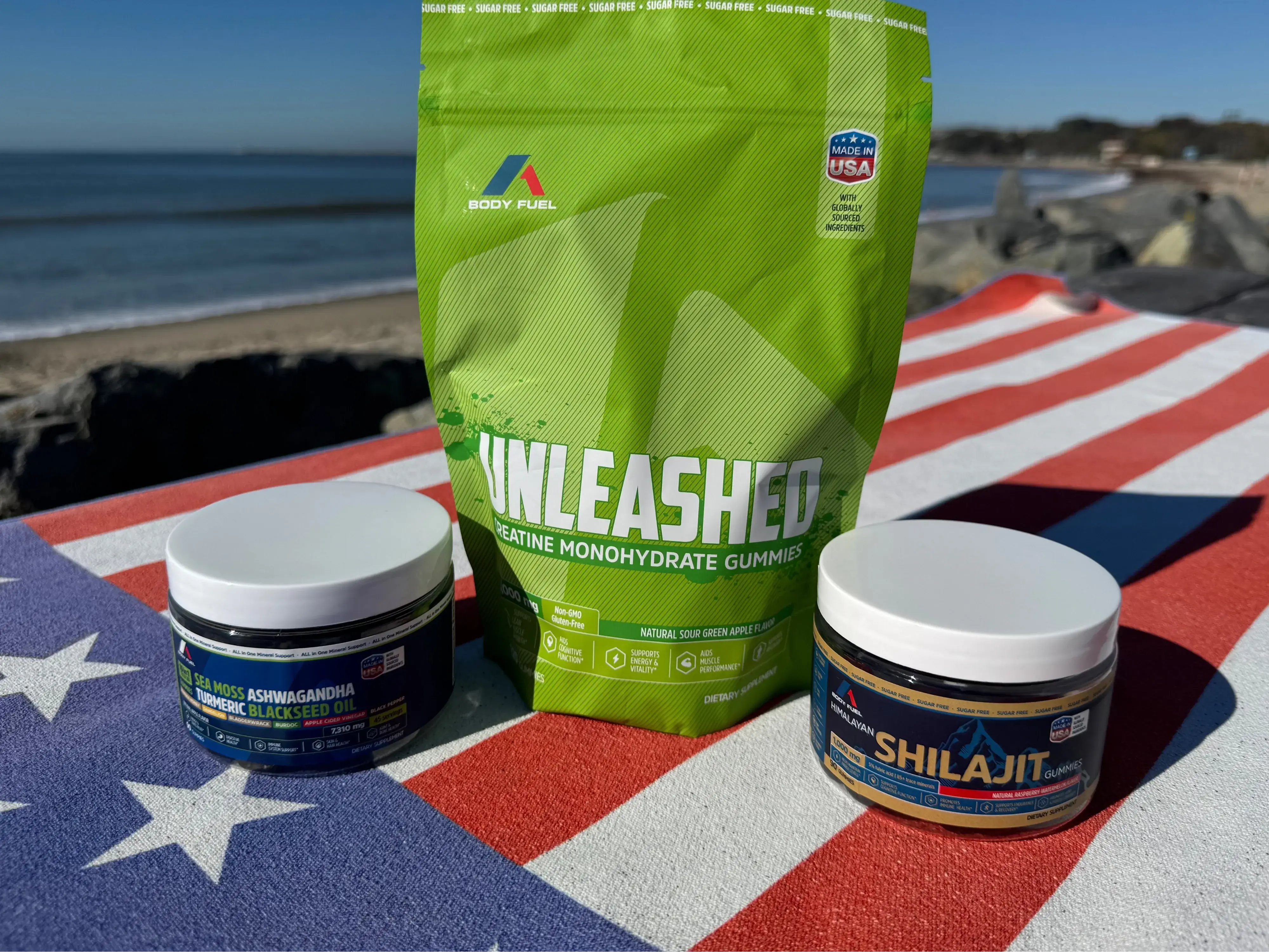 Supplement products including a green package labeled 'Unleashed' and two jars on an American flag background.